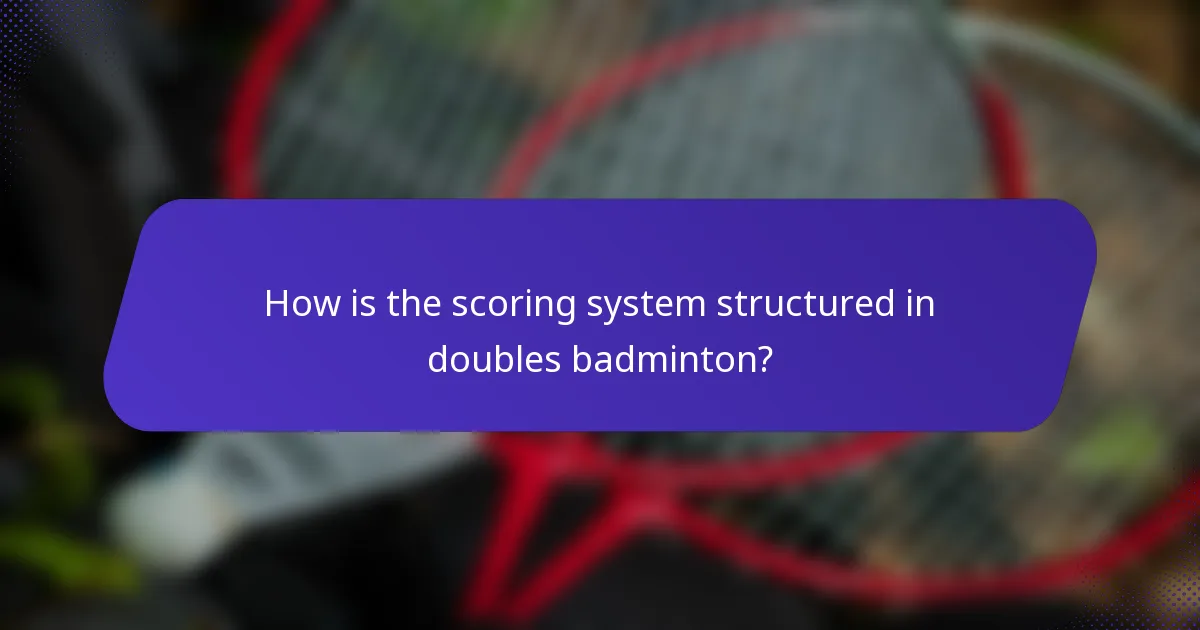 How is the scoring system structured in doubles badminton?